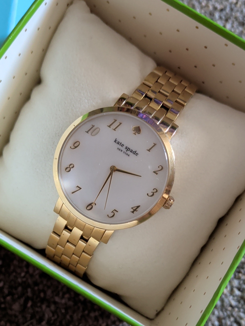 Kate Spade Gold Tone Bracelet Watch with Mother of Pearl Face.